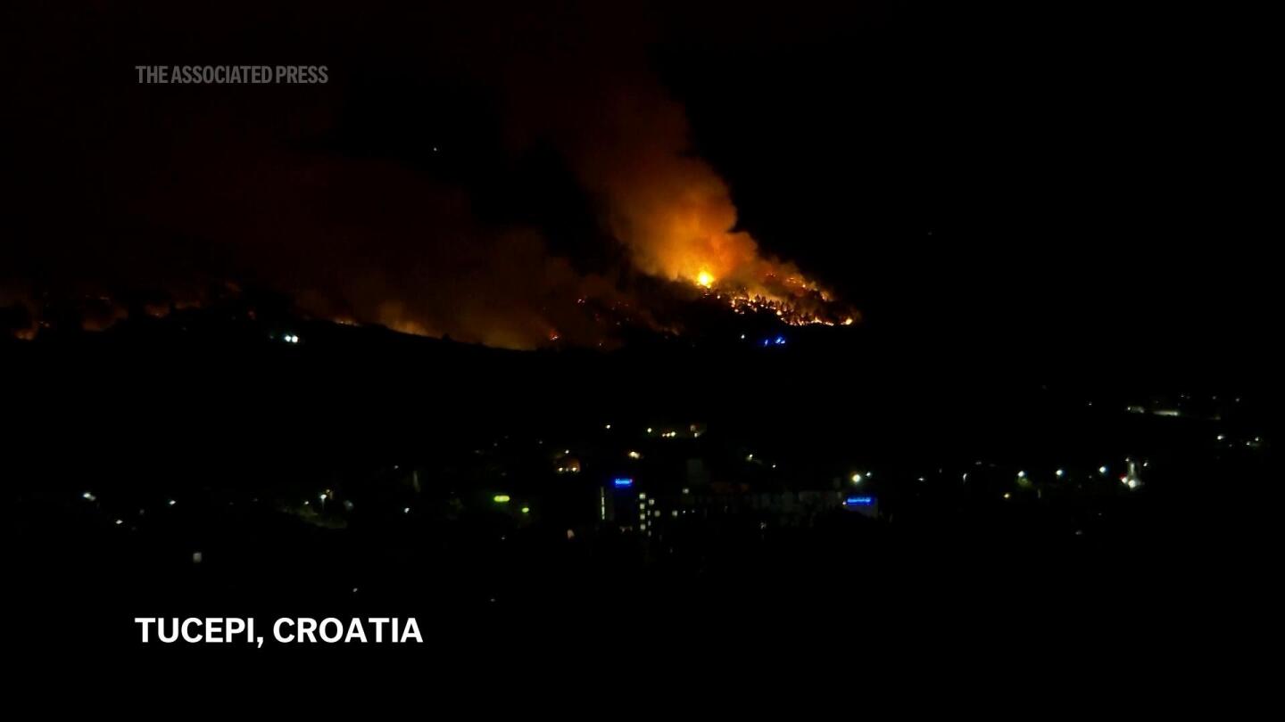 Croatian firefighters battle wildfires along coast in dramatic night | AP News