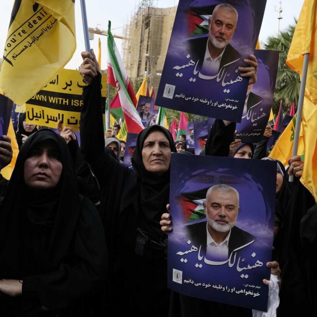 Iran’s supreme leader prays over the coffin of Hamas leader Haniyeh, whose killing risks a wider war