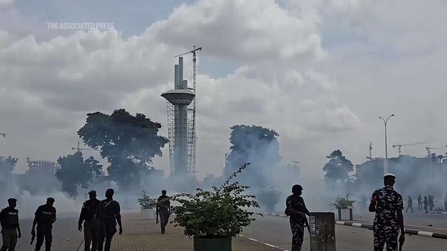 Security forces fire tear gas as anti-government protests break out across Nigeria | AP News