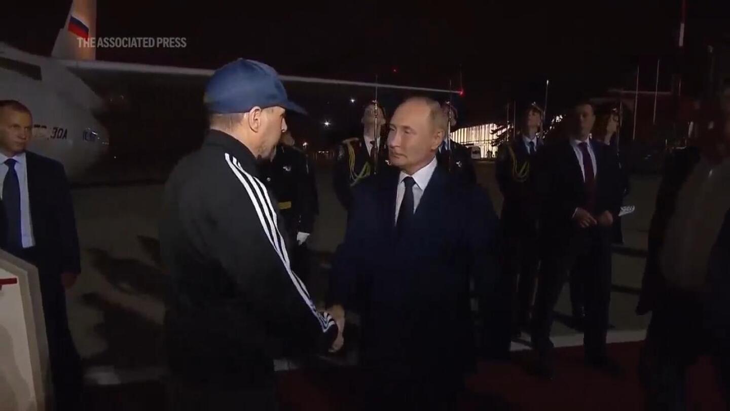 Putin greets prisoners freed in swap with US as they arrive in Moscow | AP News