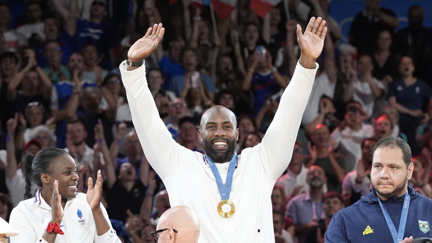 Teddy Riner stars again as France defends its Olympic title in mixed team judo, beating Japan final