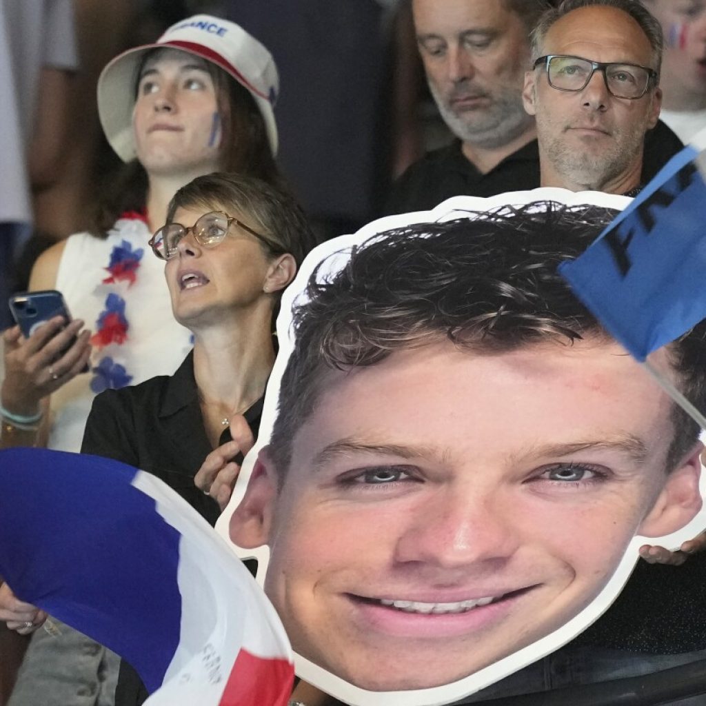 When Léon Marchand swims, nearly all of France watches – even fans at other Olympic events