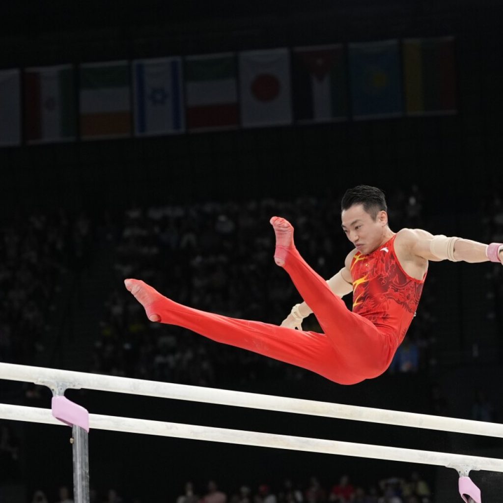 Zou Jingyuan defends parallel bars title on final day of artistic gymnastics at Paris Olympics