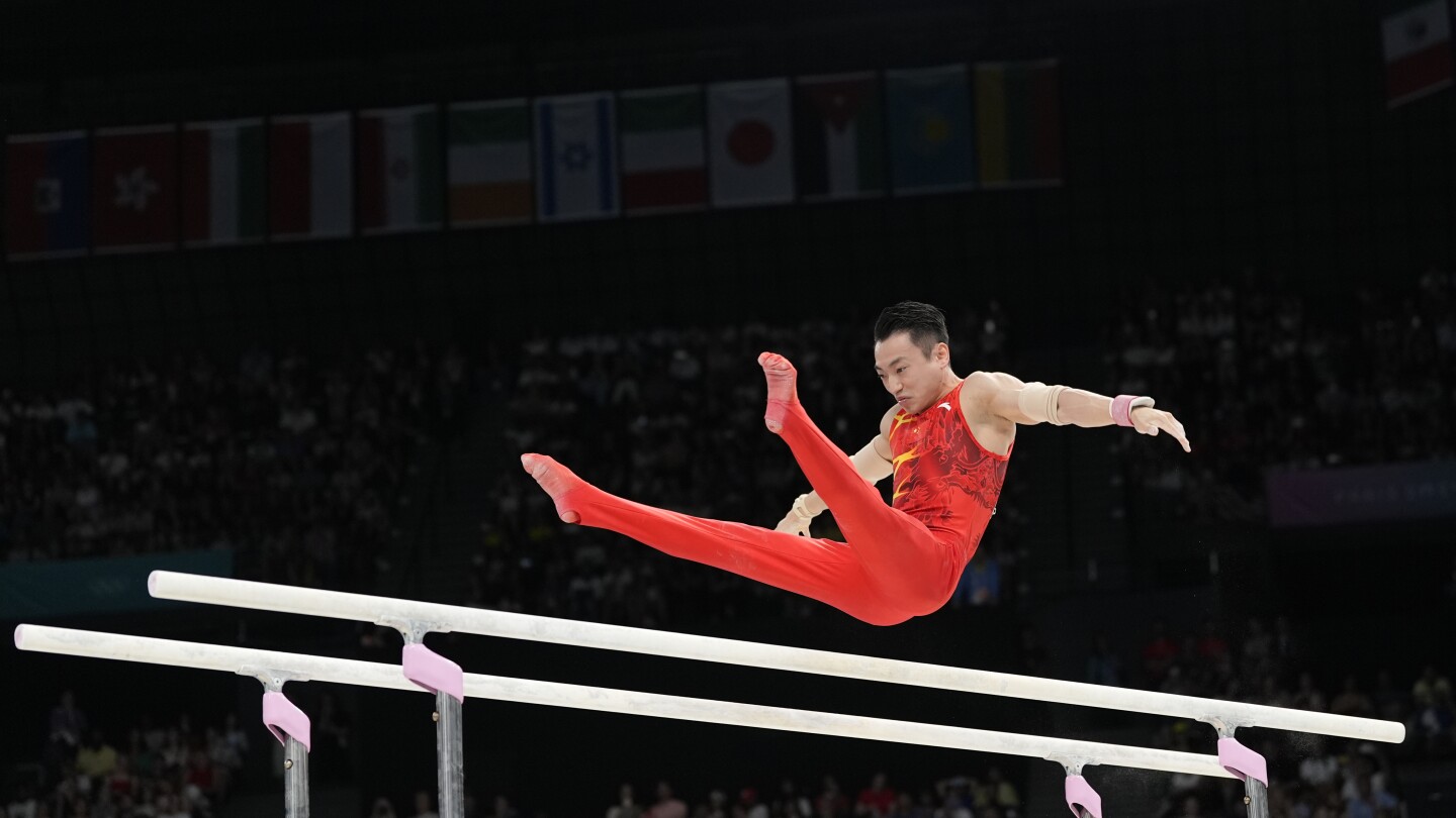 Zou Jingyuan defends parallel bars title on final day of artistic gymnastics at Paris Olympics