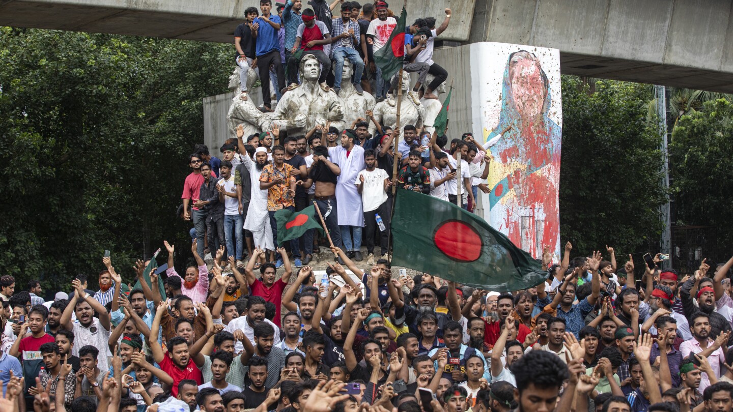 Bangladesh protesters celebrate as longtime prime minister steps down and flees abroad