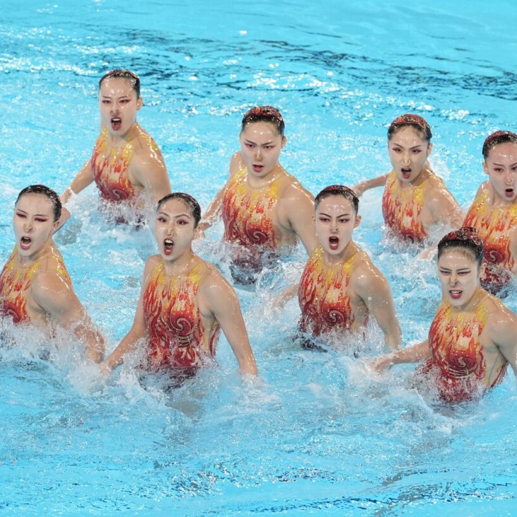 With Russians absent, China leads after team technical routine at Olympic artistic swimming