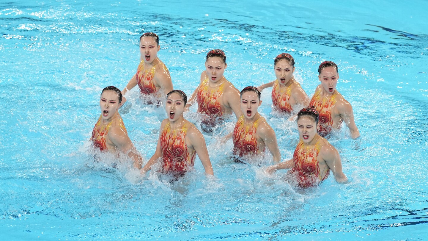 With Russians absent, China leads after team technical routine at Olympic artistic swimming