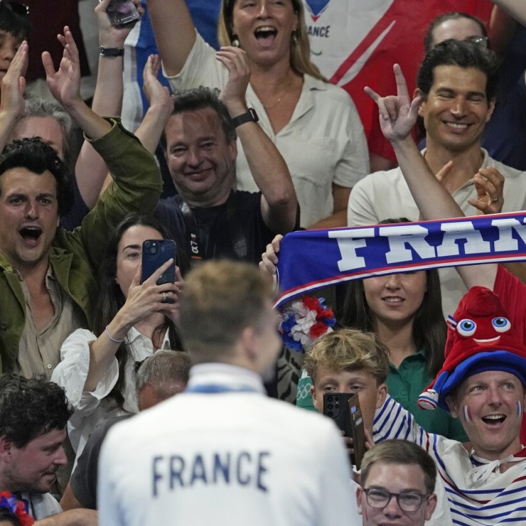 Can Olympic swimming in LA’s SoFi Stadium match the atmosphere in Paris’ La Defense Arena?