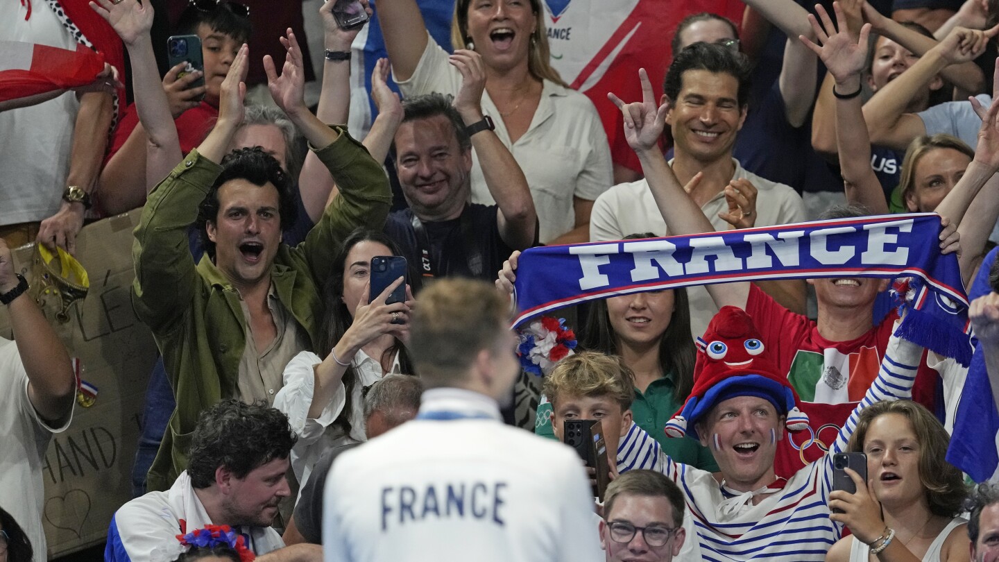 Can Olympic swimming in LA’s SoFi Stadium match the atmosphere in Paris’ La Defense Arena?