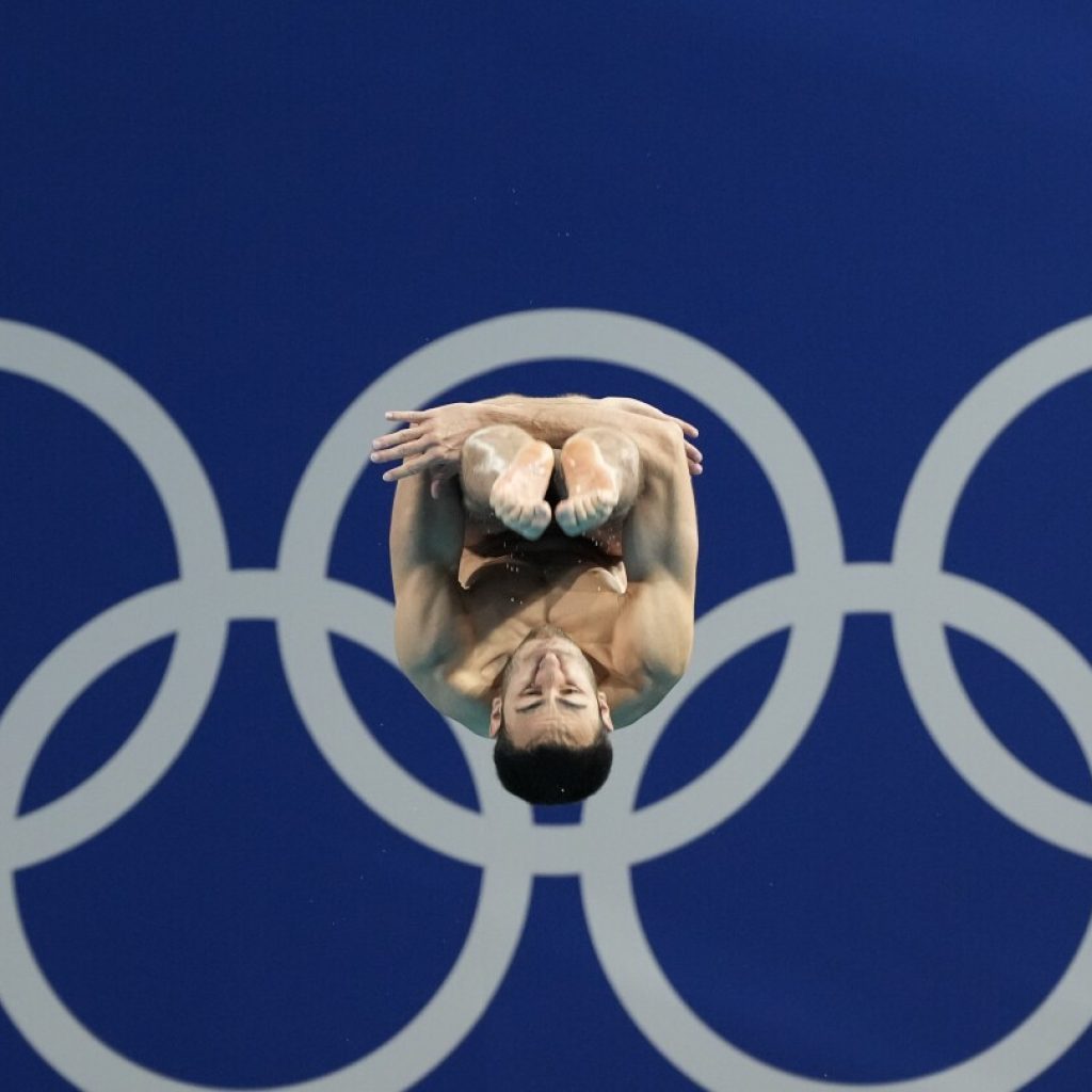 One Extraordinary (Olympic) Photo: Lee Jin-man captures diver at the center of the Olympic rings