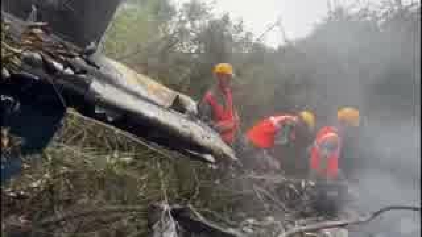 Emergency workers at site of Nepal helicopter crash | AP News