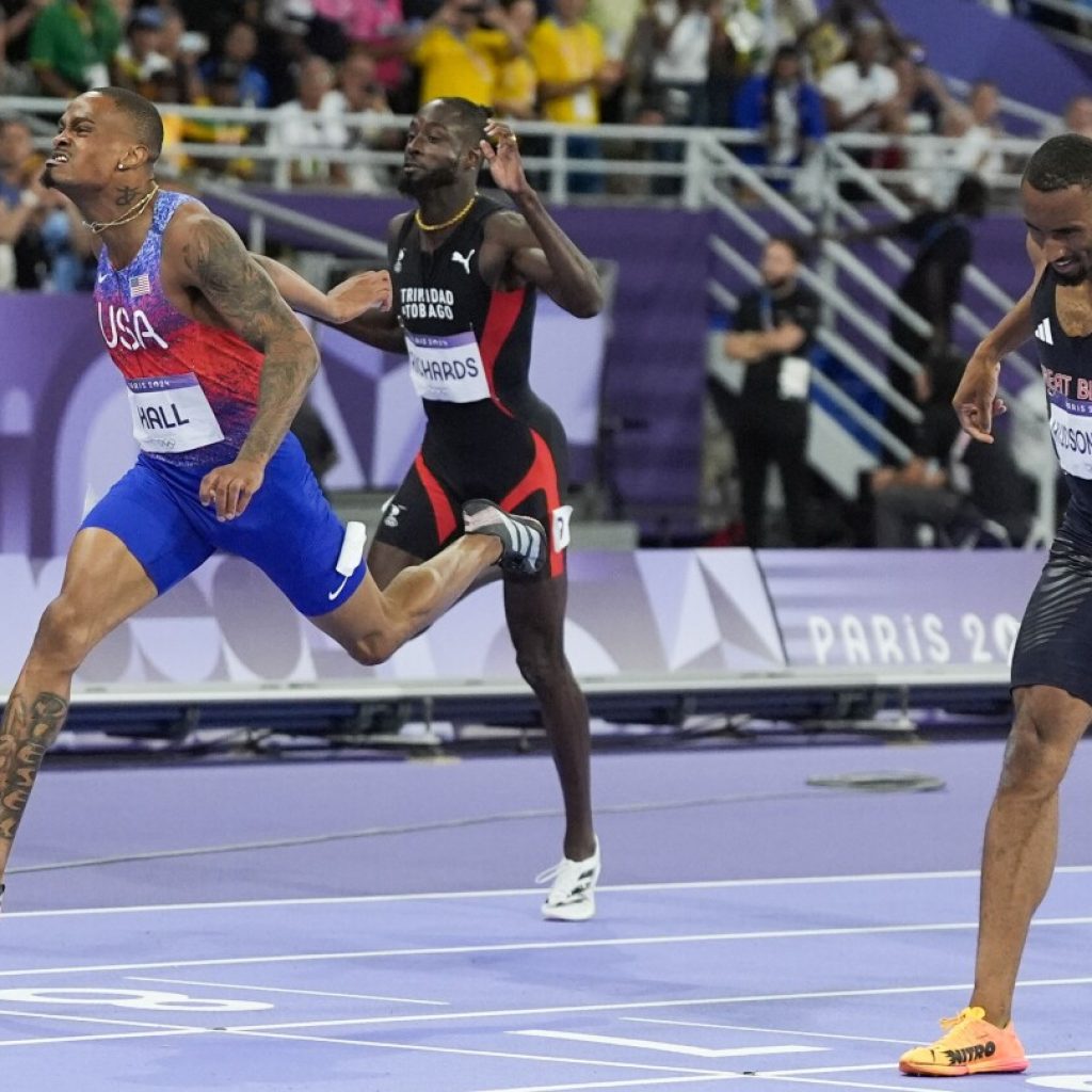 Latest US track comeback puts Quincy Hall atop the medal stand in Olympic 400 meters