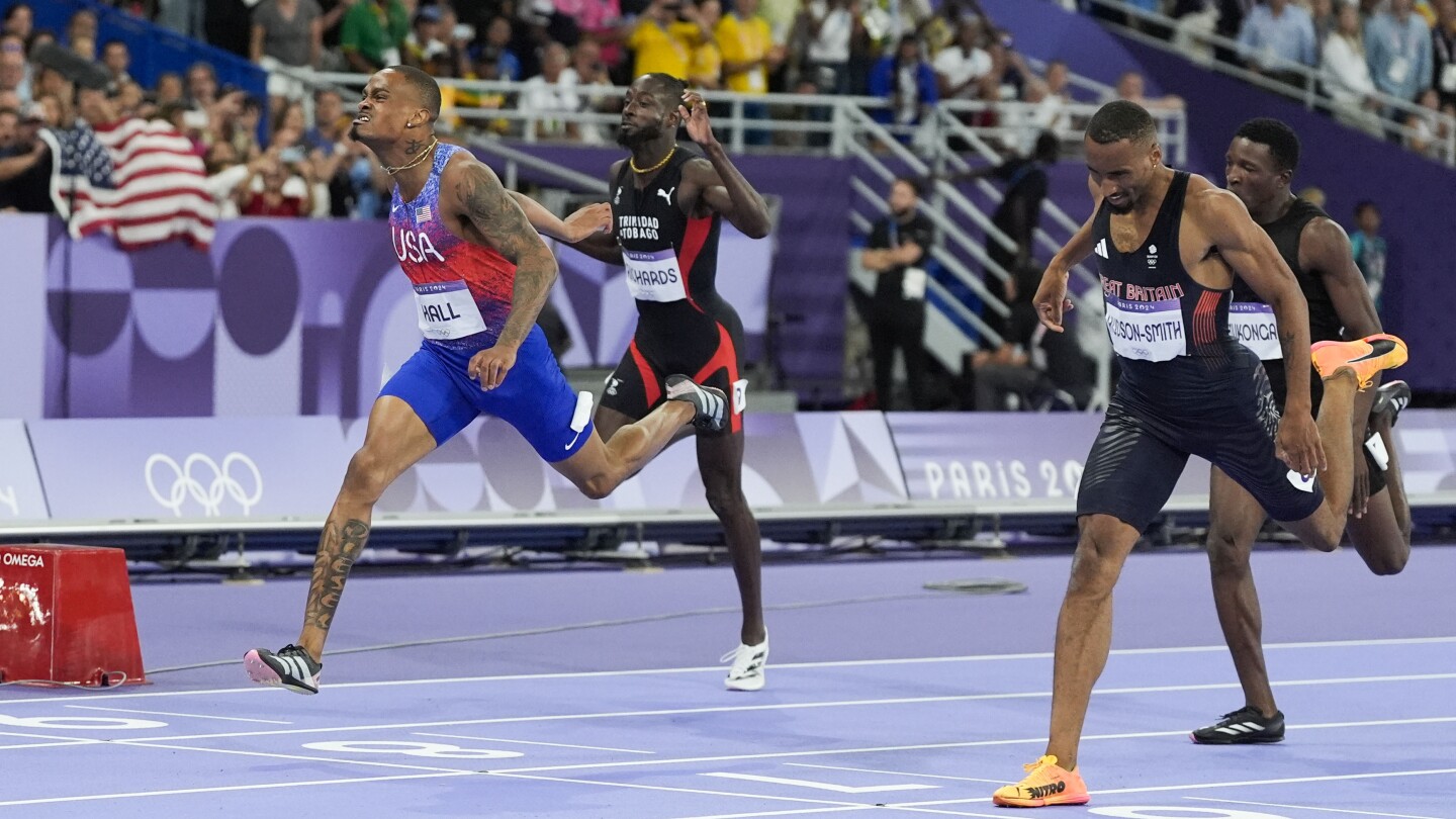 Latest US track comeback puts Quincy Hall atop the medal stand in Olympic 400 meters