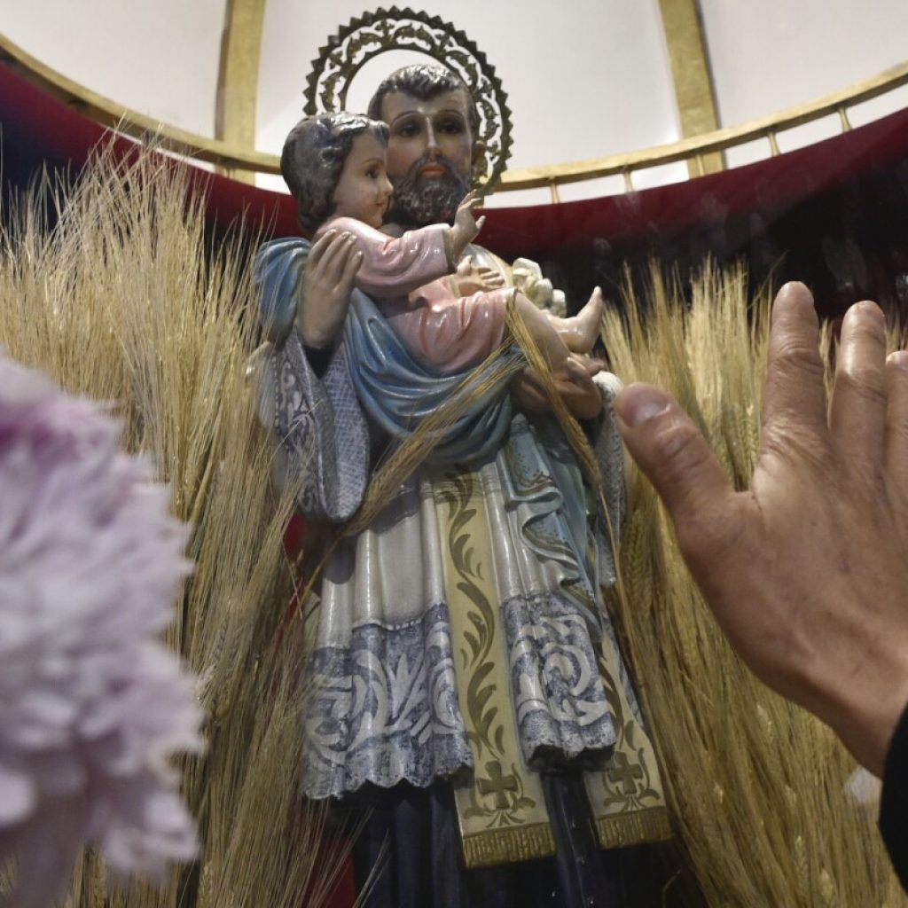 As President Milei’s austerity hits hard, jobless Argentines appeal to the patron saint of work