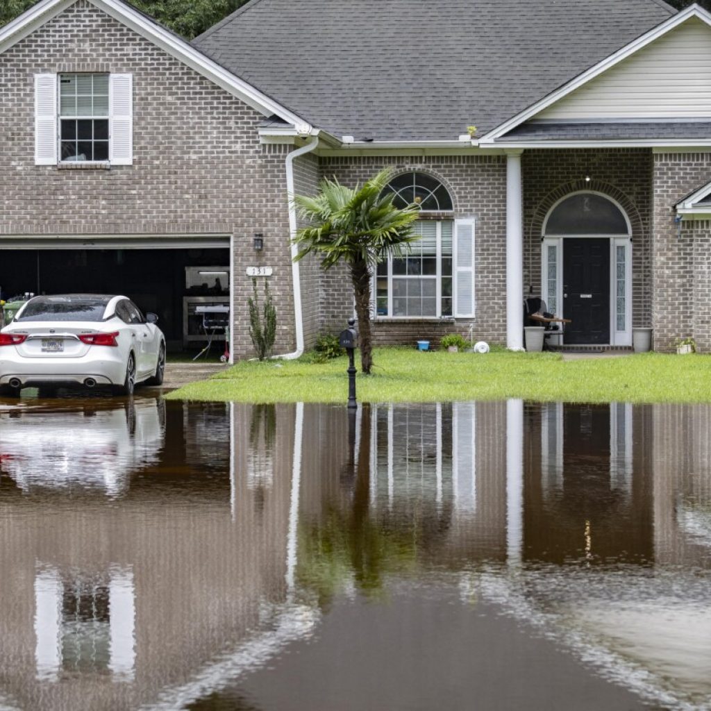 Tropical rains flood homes in an inland Georgia neighborhood for the second time since 2016