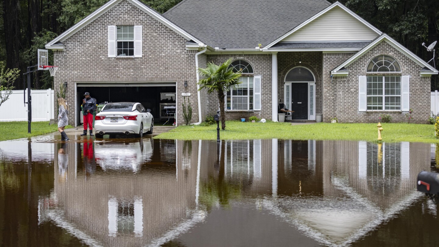 Tropical rains flood homes in an inland Georgia neighborhood for the second time since 2016