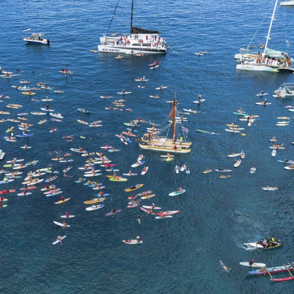 Maui remembers the 102 lost in the Lahaina wildfire with a paddle out 1 year after devastating blaze