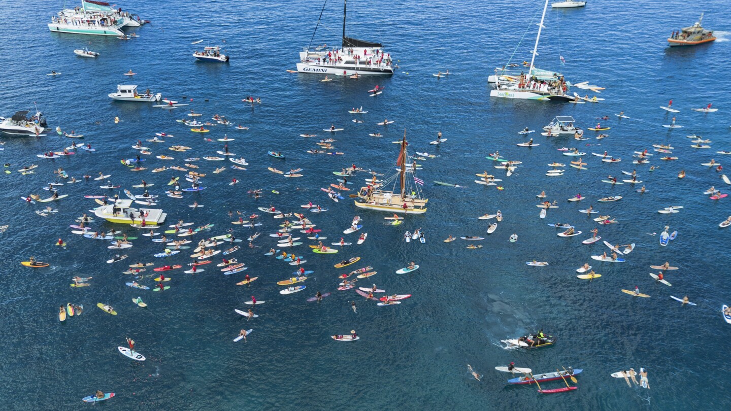 Maui remembers the 102 lost in the Lahaina wildfire with a paddle out 1 year after devastating blaze