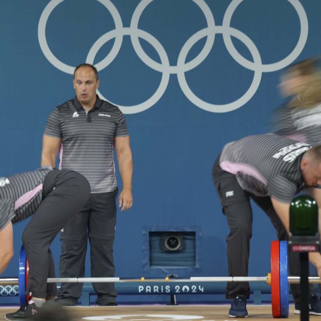 Like pit crews but in weightlifting. How loaders keep the Olympic sport going