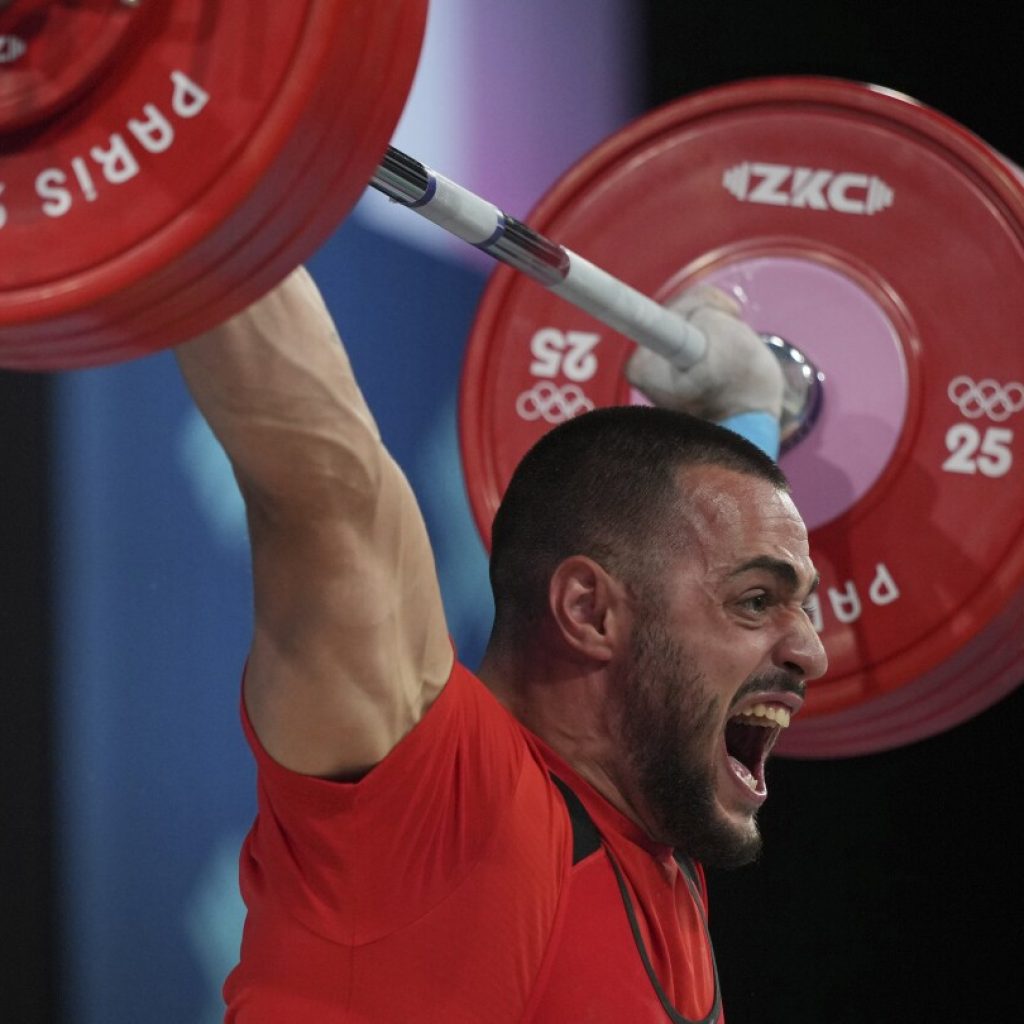 Bulgaria weightlifter wins gold 15 months since a hotel sink fell and severed an Achilles tendon