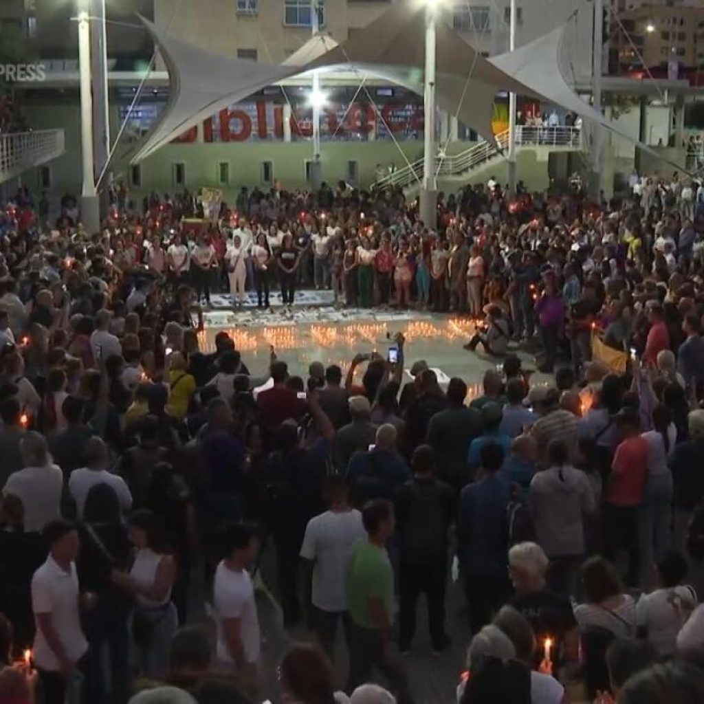 Demonstrators hold vigil for detained protesters in Venezuela capital and pray for peace and freedom | AP News