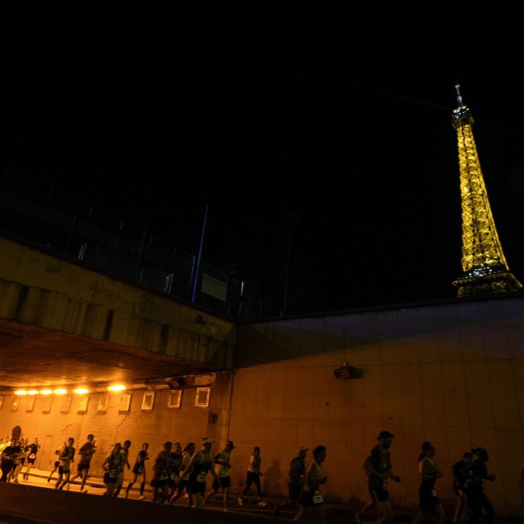 Amateur runners race like Olympians along the same iconic route as competitors in Paris