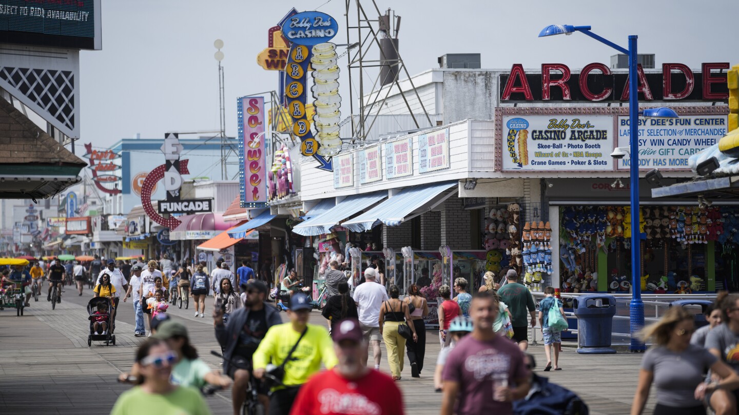 Summer tourists flock to boardwalks and piers while sticking to their budgets