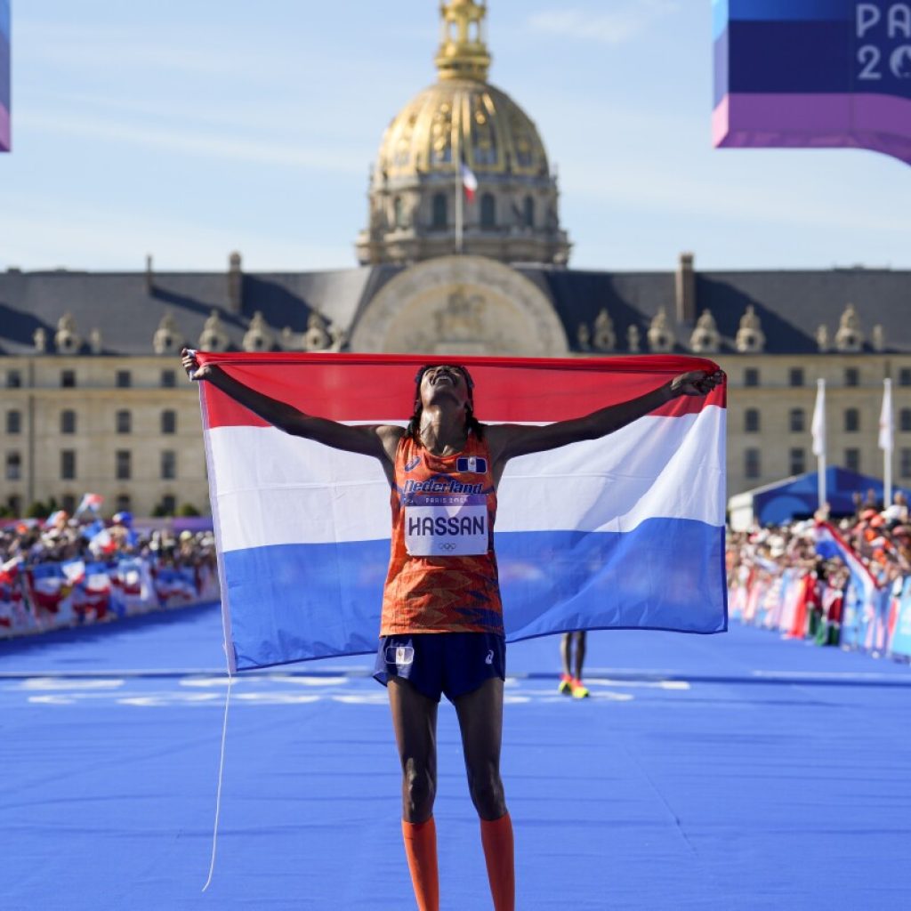 Sifan Hassan wins women’s marathon at Paris Olympics after trading elbows with Tigst Assefa