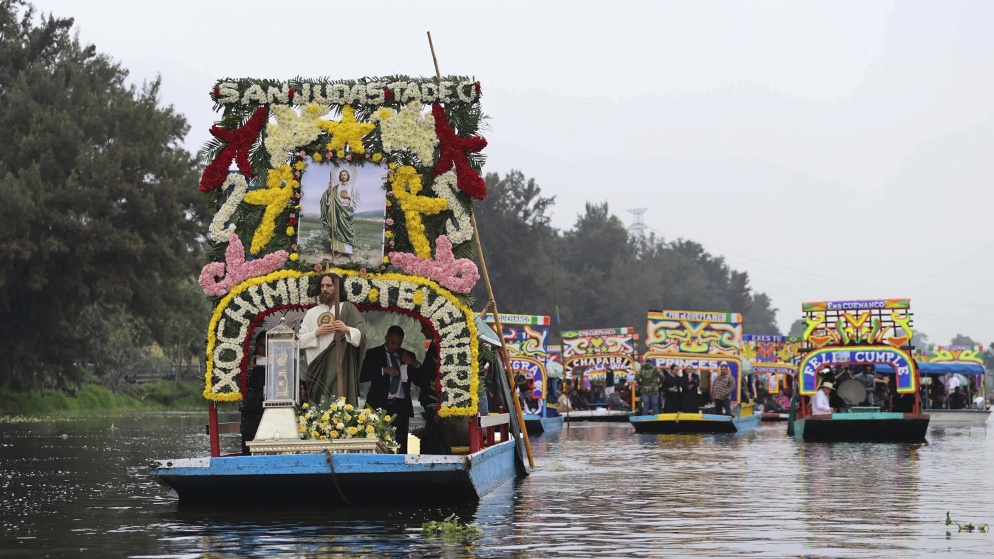 Catholic devotees honor St Jude’s relic with watery procession through Mexico’s Xochimilco canals