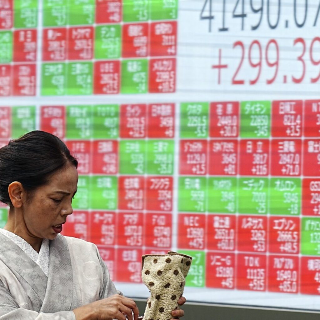 Asian shares mixed as jitters calm over global markets while uncertainty lingers