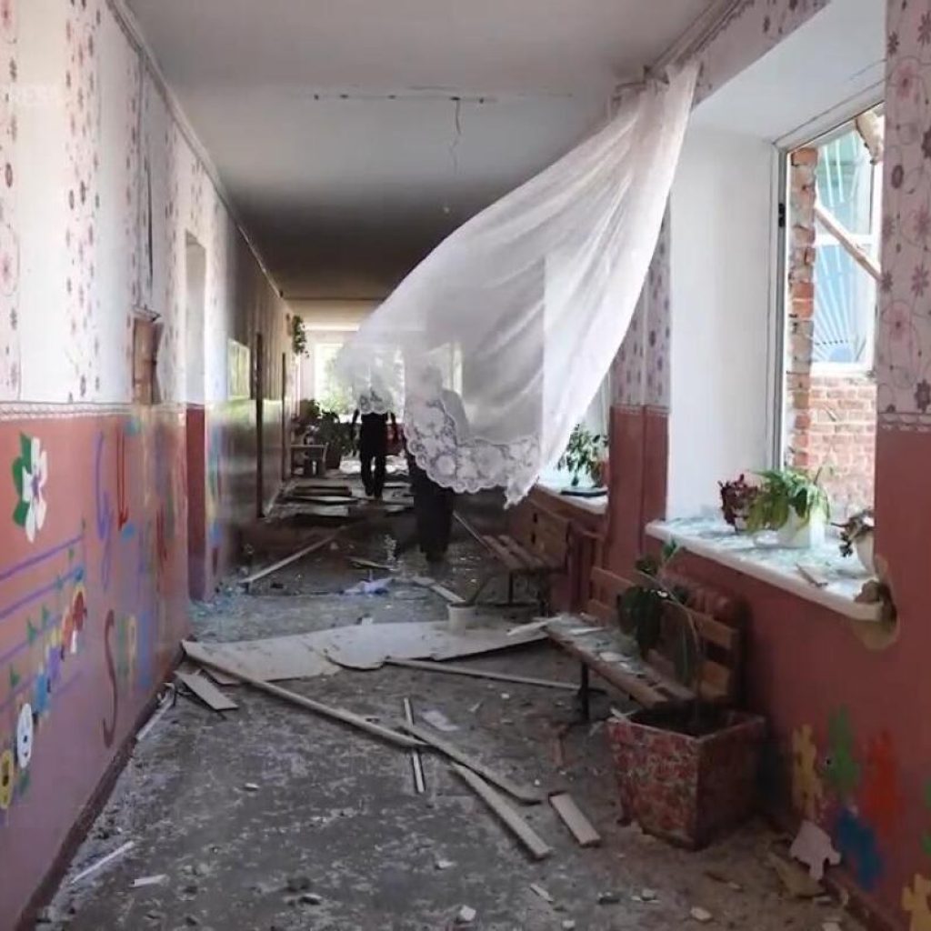 Ukrainian school guard shows damage from Russian strike in days after Kyiv launched incursion | AP News