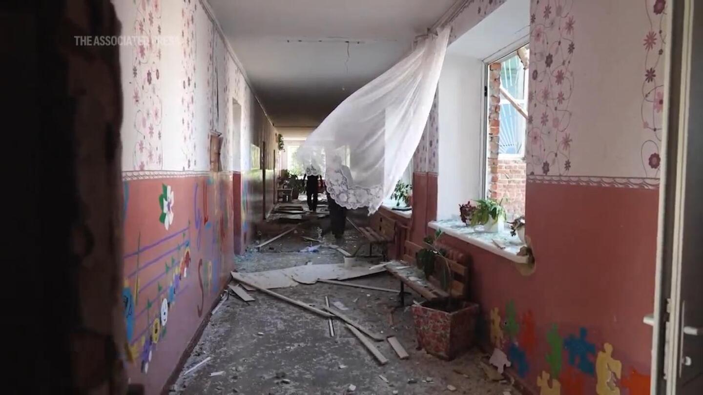 Ukrainian school guard shows damage from Russian strike in days after Kyiv launched incursion | AP News