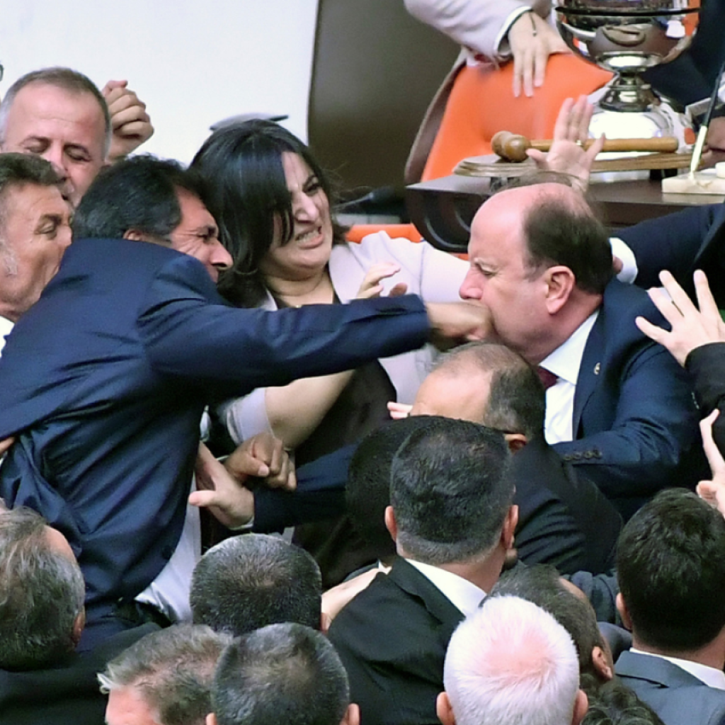 Lawmakers in Turkey draw blood in brawl during parliament debate on jailed colleague | AP News