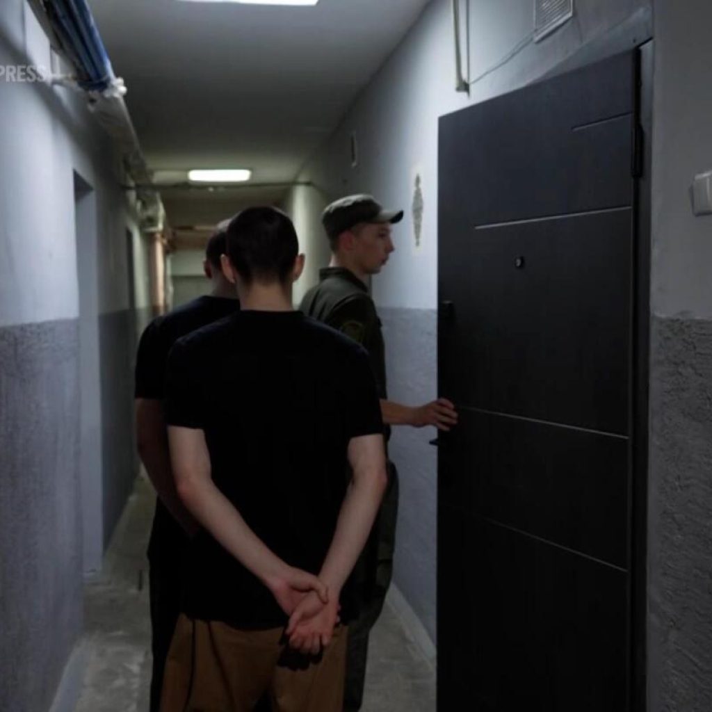 Ukraine offers rare look inside detention center housing Russian troops captured in battle | AP News