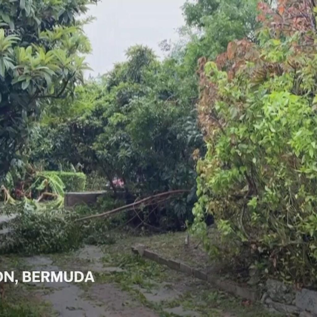 Residents clean up after Hurricane Ernesto made landfall on Bermuda as Category 1 storm | AP News