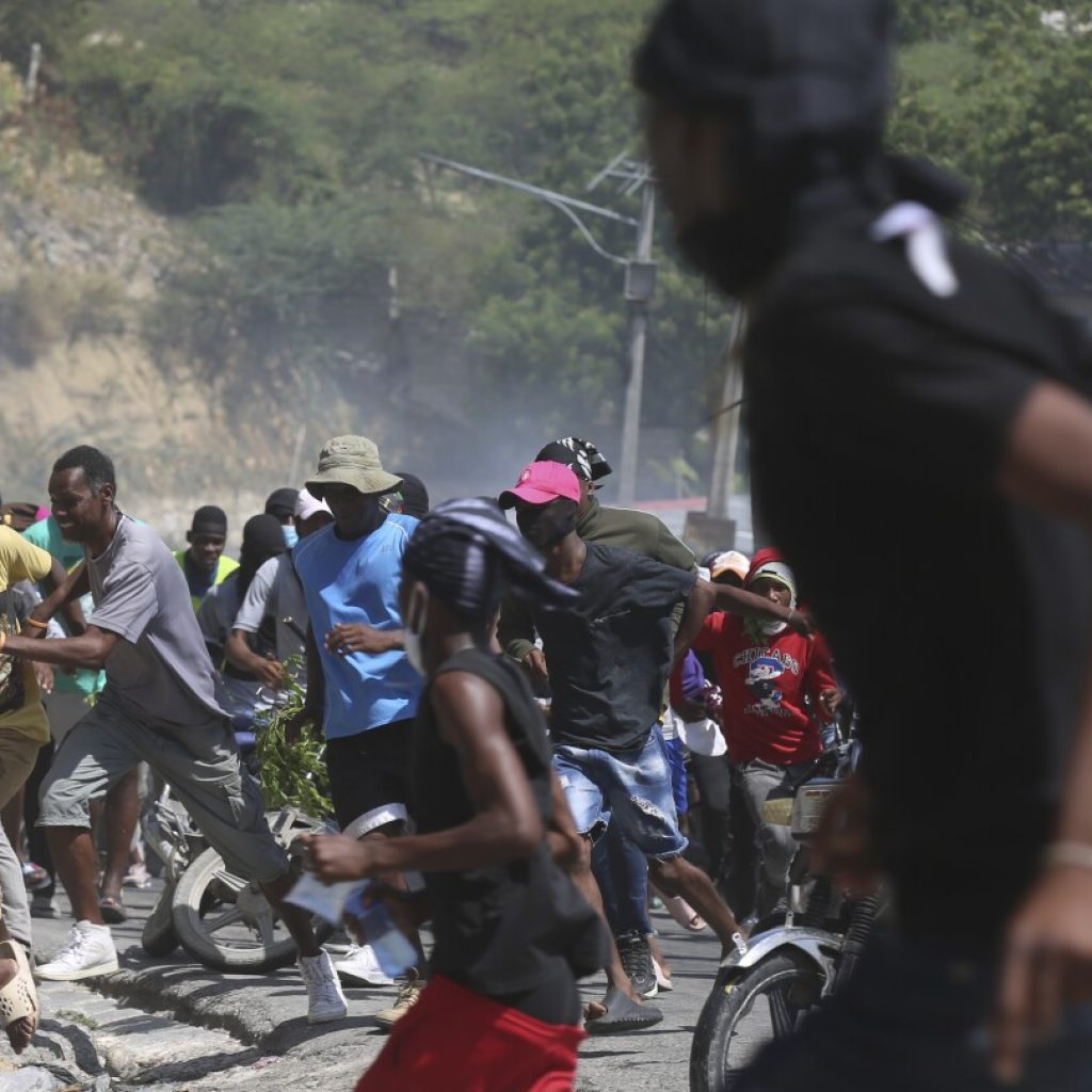 Haitian police tear-gas peaceful protesters as they demand help in stopping gangs