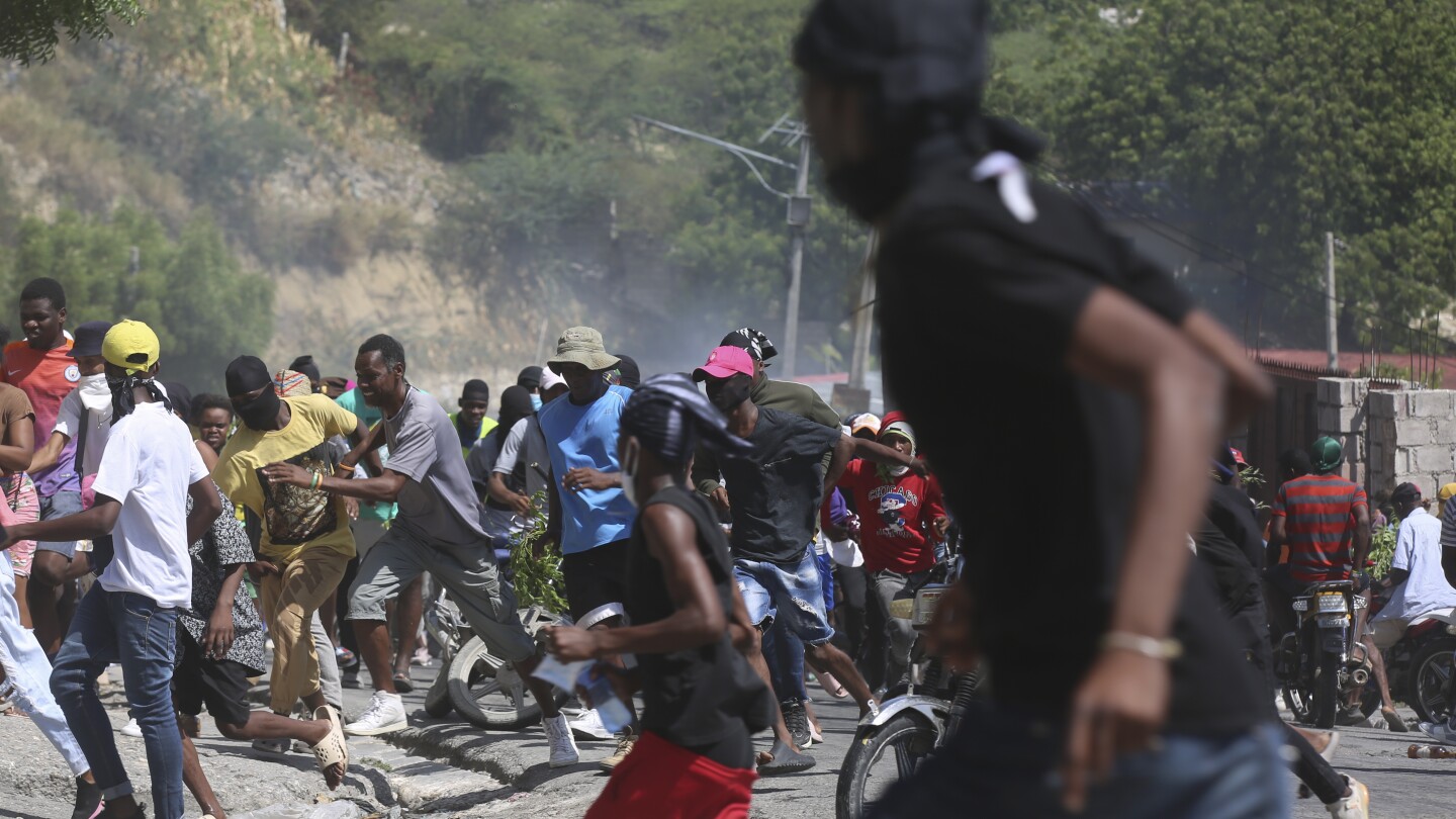 Haitian police tear-gas peaceful protesters as they demand help in stopping gangs