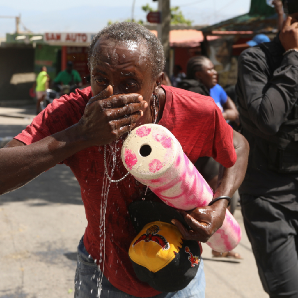 Tear gas deployed at protesters in Haiti capital as gang violence continues | AP News