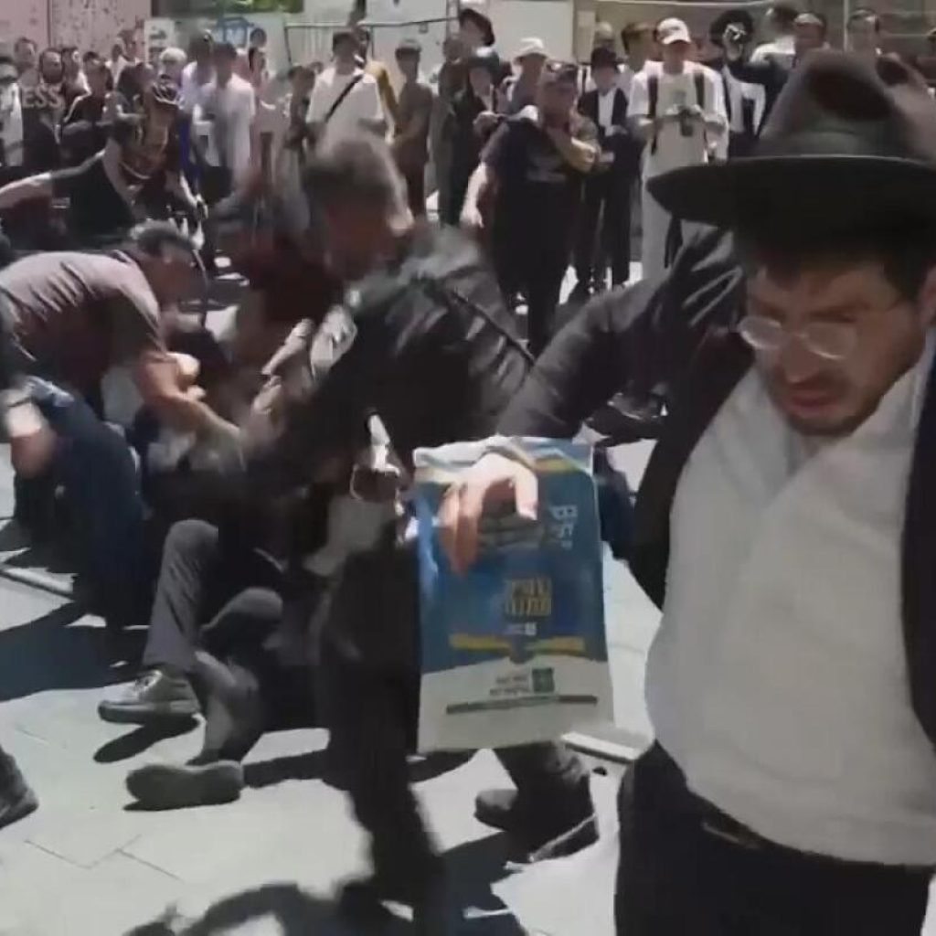 Orthodox Jewish protesters against military service law forcibly removed by police in Jerusalem | AP News