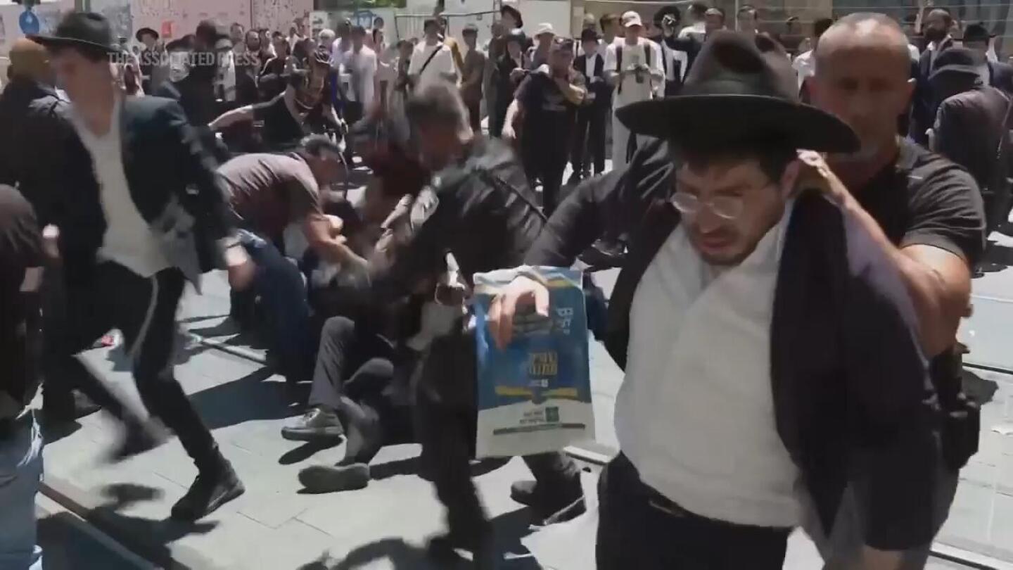 Orthodox Jewish protesters against military service law forcibly removed by police in Jerusalem | AP News