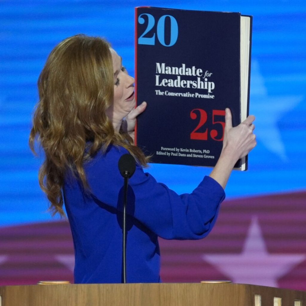 Throwing the book: Democrats enlarge a copy of the ‘Project 2025’ blueprint as an anti-GOP prop