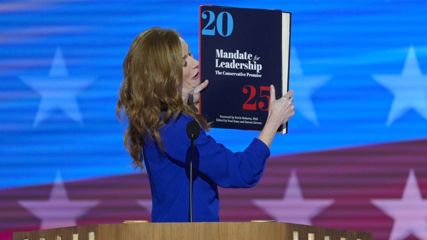 Throwing the book: Democrats enlarge a copy of the ‘Project 2025’ blueprint as an anti-GOP prop