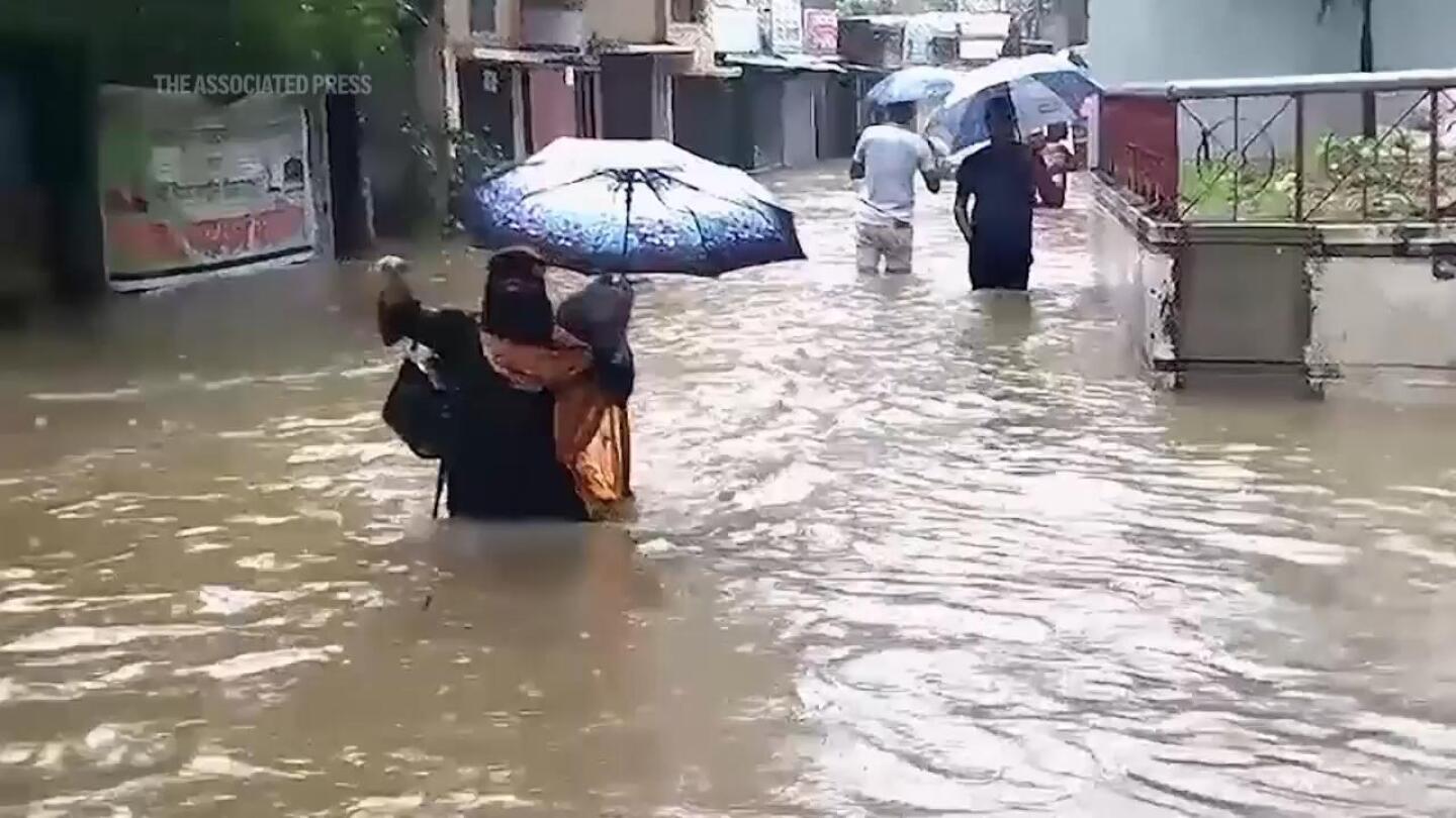 Floods maroon many people in Bangladesh and India and cause at least 15 deaths | AP News