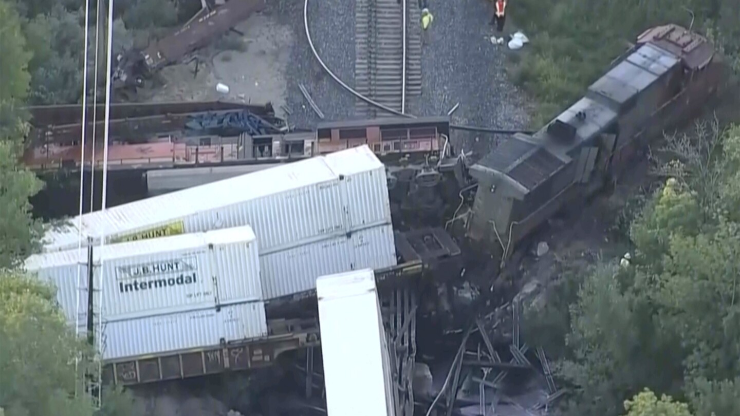 2 freight trains collided in Colorado, damaging a bridge, spilling fuel and injuring 2 conductors