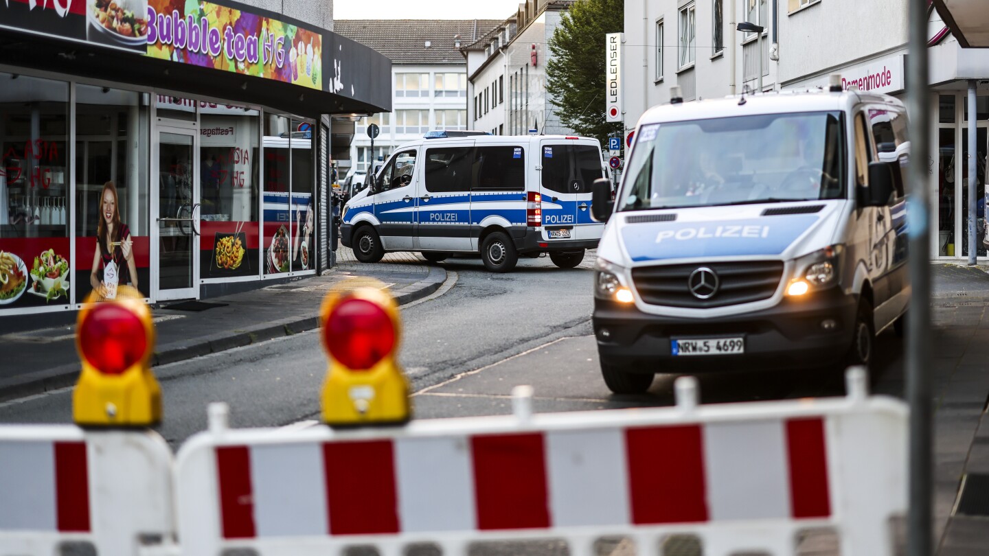 Police search for the man who killed 3 in a knife attack in the German city of Solingen