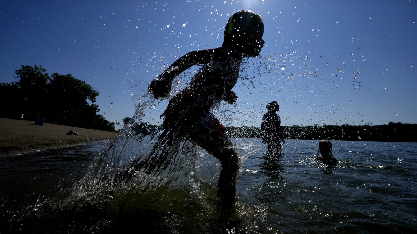 Wild week of US weather includes heat wave, tropical storm, landslide, flash flood and snow