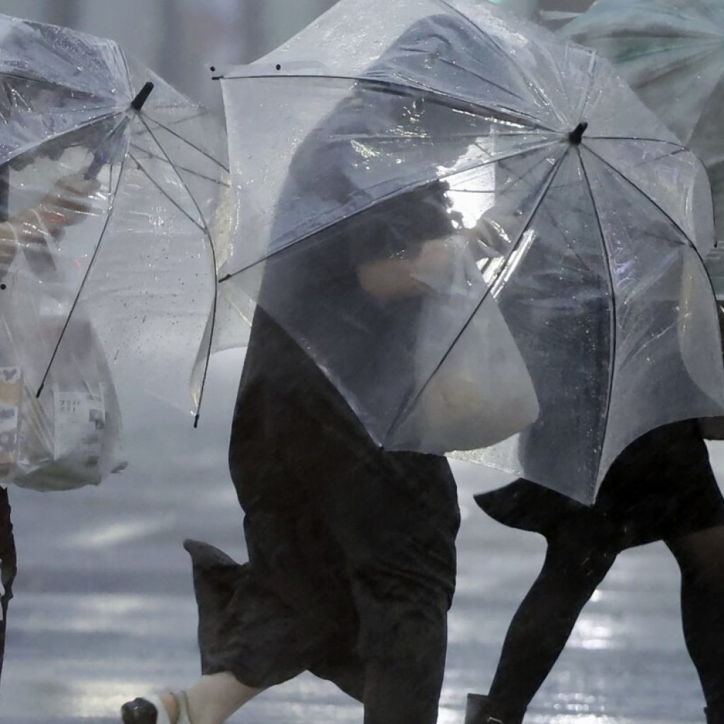 Typhoon lashes Japan with torrential rain and strong winds on a slow crawl north