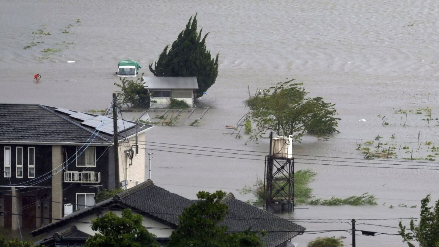 Typhoon Shanshan lashes Japan with torrential rain and strong winds | AP News