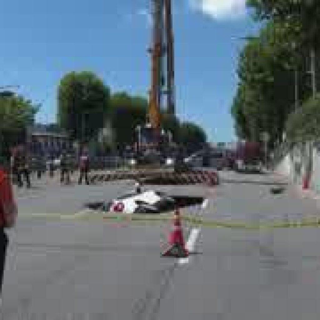 Sinkhole swallows a car in South Korea, injuring two people | AP News