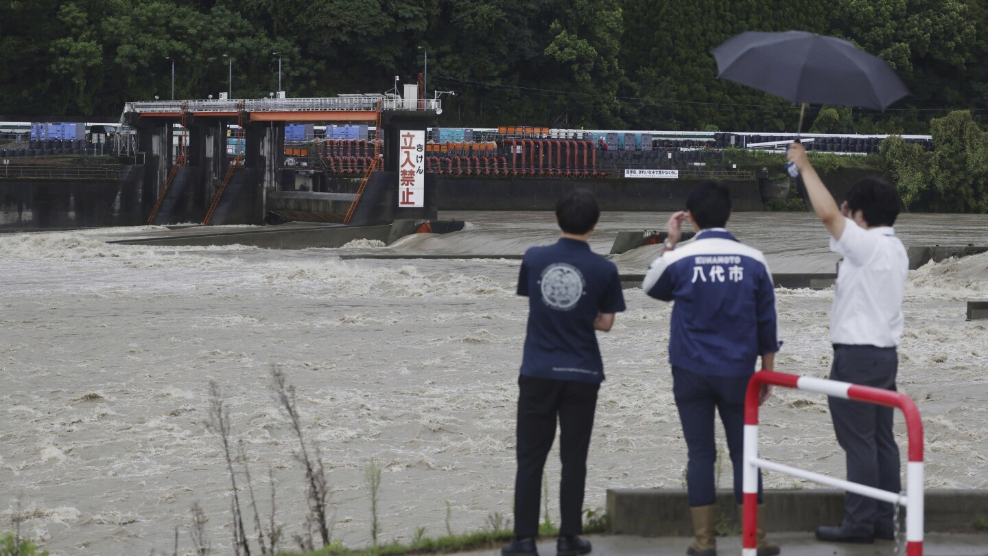 Slow tropical storm dumps heavy rain around Tokyo after causing floods in southern Japan